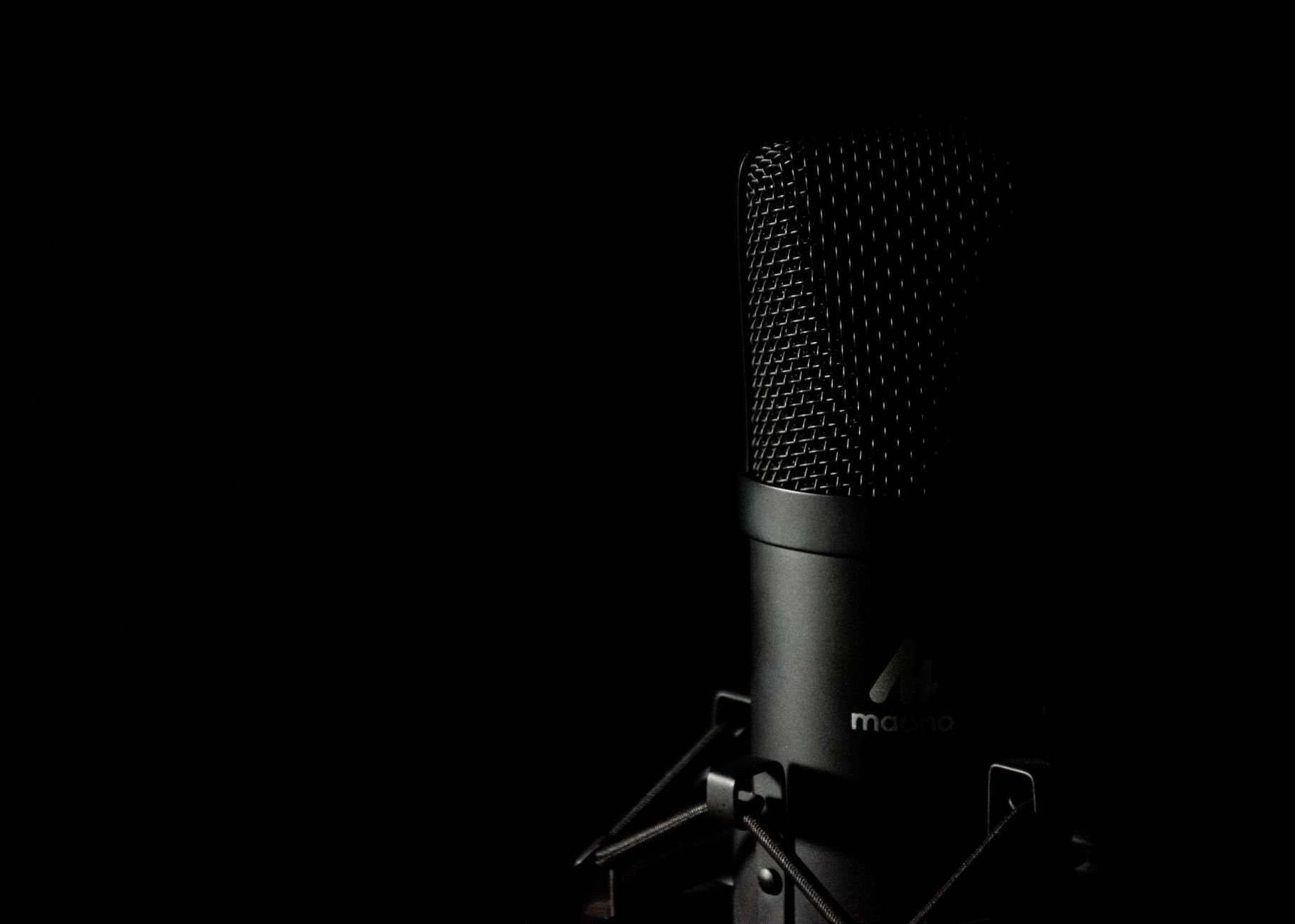 Studio microphone with dark background for audio production